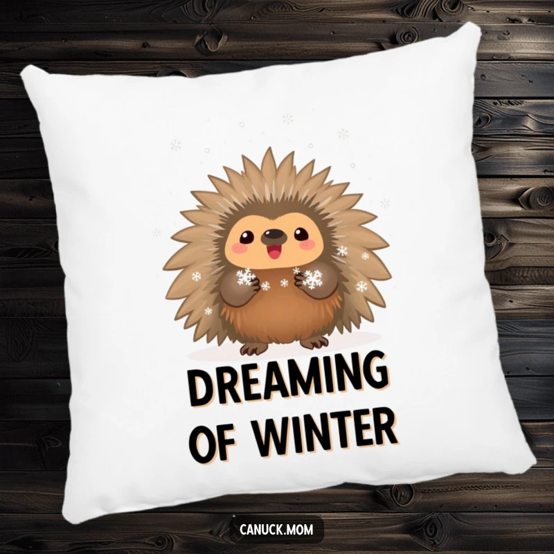 Funny proud porcupine holding tiny snowflakes, featured on a soft and decorative pillow.