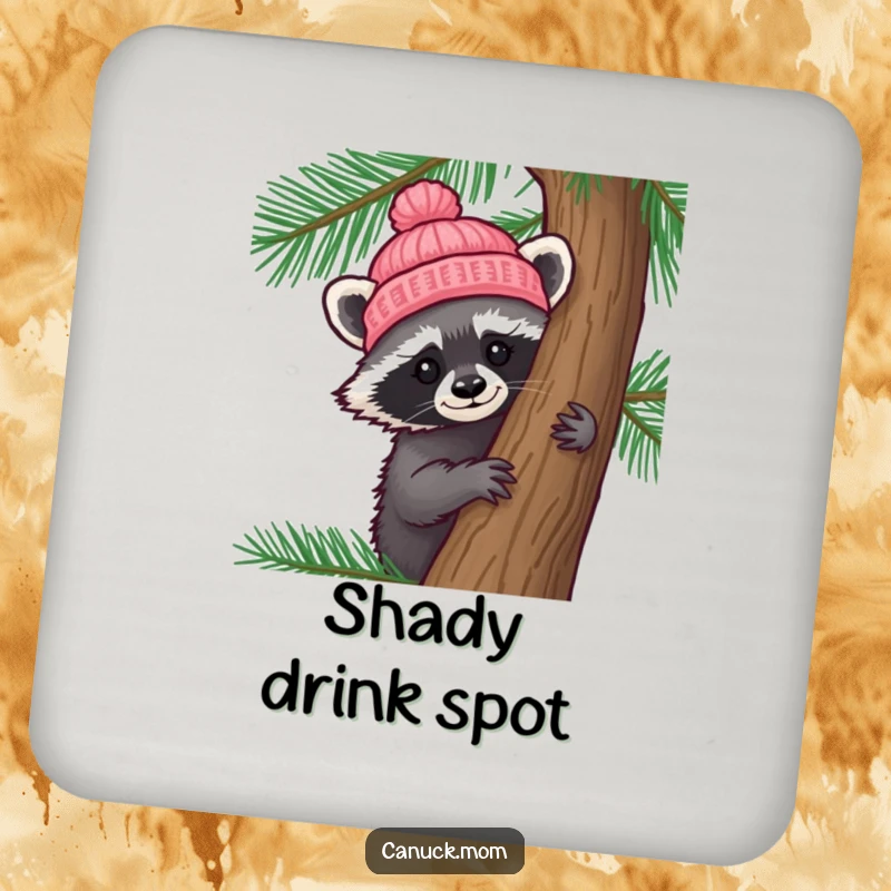 Funny Raccoon Hat Drink Coaster: A curious raccoon wearing a tiny knitted hat peeks from behind a pine tree, protecting surfaces.