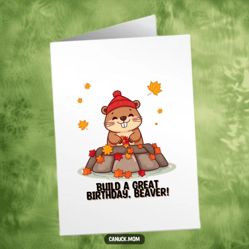 Funny Free Printable Birthday Card: Happy beaver in a red toque building a dam with maple leaves, perfect for a downloadable gift.