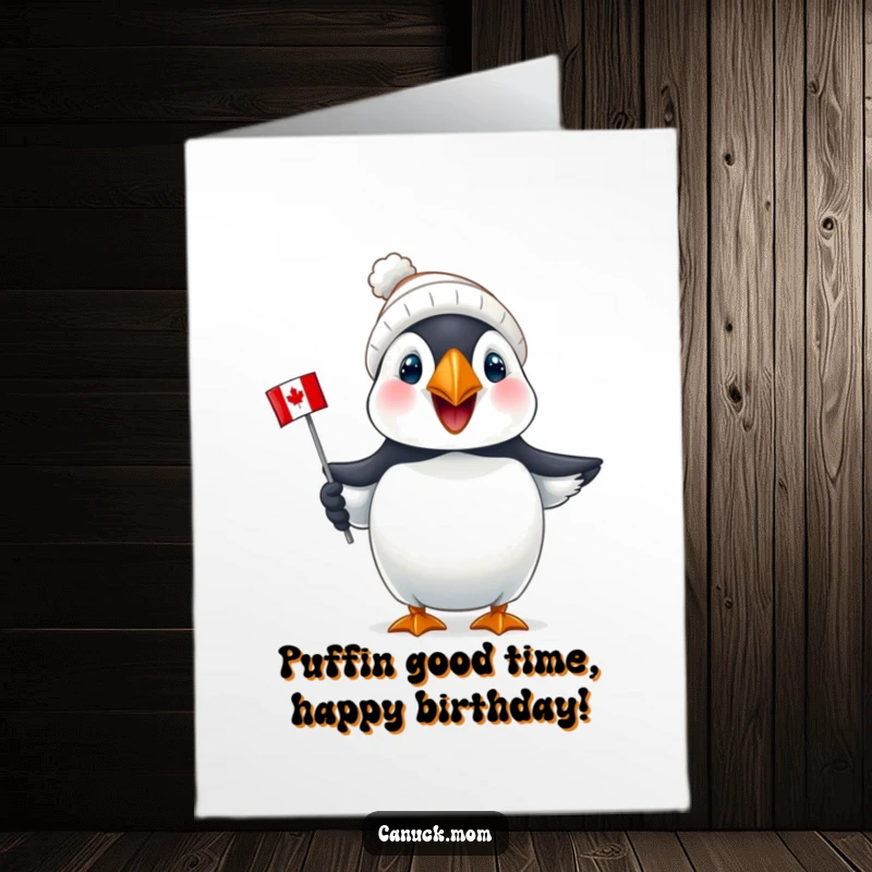 Funny Free Printable Birthday Card: Joyful puffin wearing a tiny toque holds a mini Canadian flag, ready to celebrate.