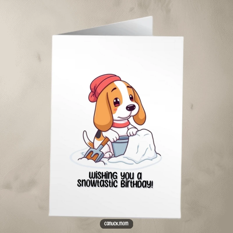 Free Printable Birthday Card: A Basset hound with pail and shovel diligently builds a snow fort, ready for fun.