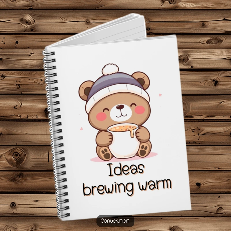 Funny notebook with a cute bear in a toque, sipping hot cocoa, inspiring creativity and cozy thoughts.