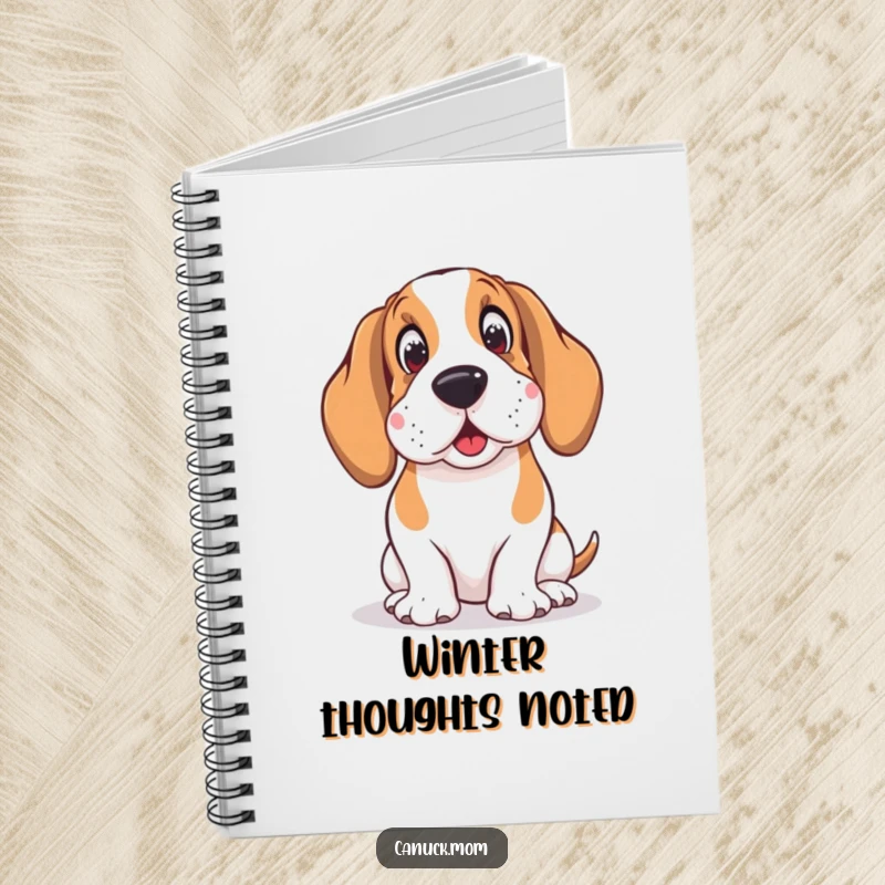 Funny notebook with a Basset Hound wearing earmuffs, looking amused by snowflakes, perfect for journaling winter thoughts.
