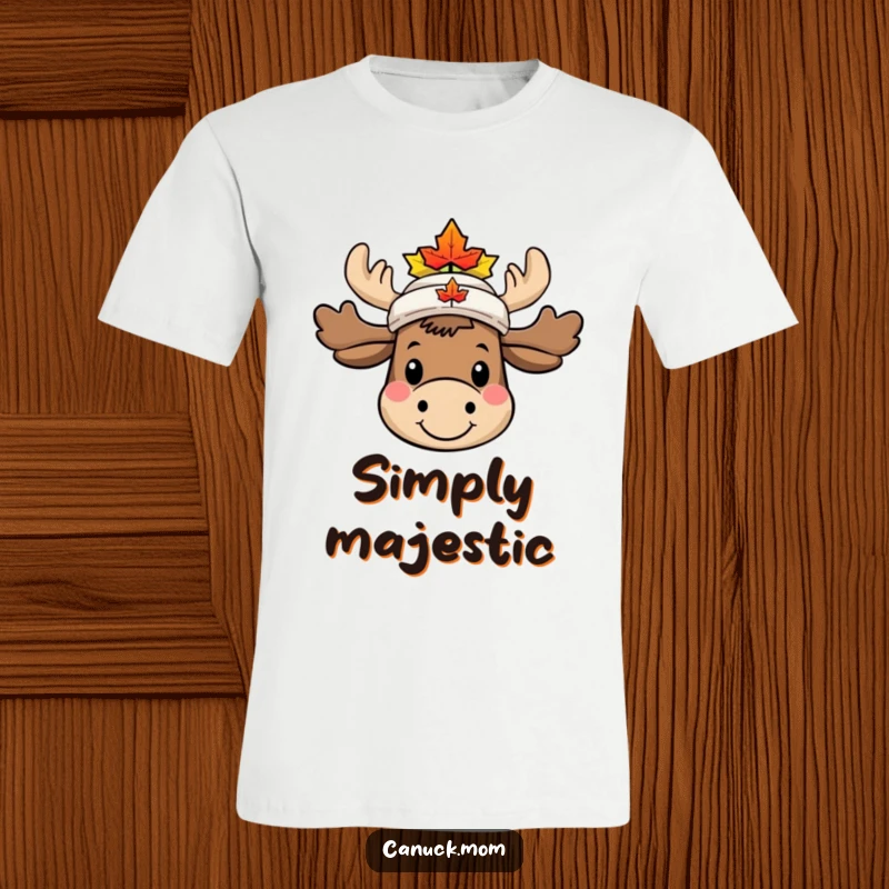Funny Moose T-Shirt, smiling with a tiny maple leaf hat, showcasing cute Canadian woodland character humor.
