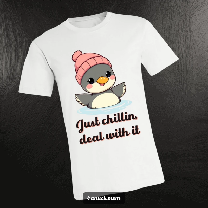 Funny Loon Beanie T-Shirt: A smiling loon wearing a winter beanie floats on water, showcasing a relaxed and humorous vibe.