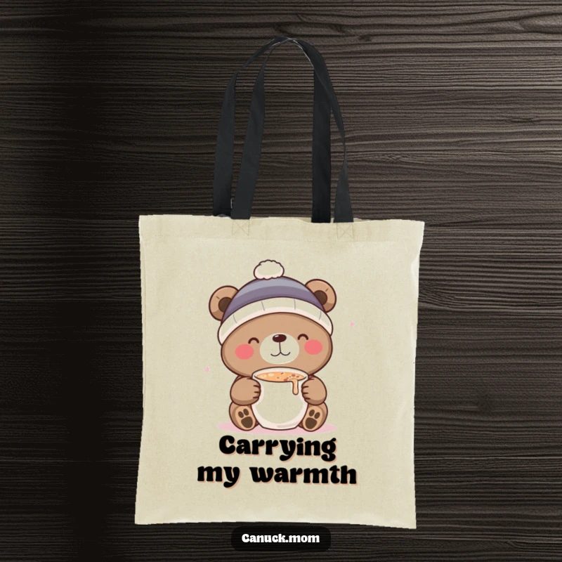 Funny tote bag showcasing a bear in a toque, delightedly sipping hot cocoa, perfect for carrying winter cheer.