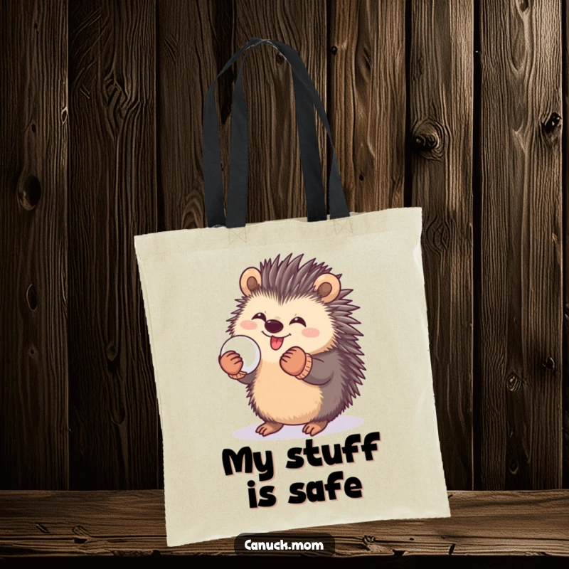 Funny tote bag showcasing a happy porcupine wearing mittens, holding a snowball, ready for playful adventures.