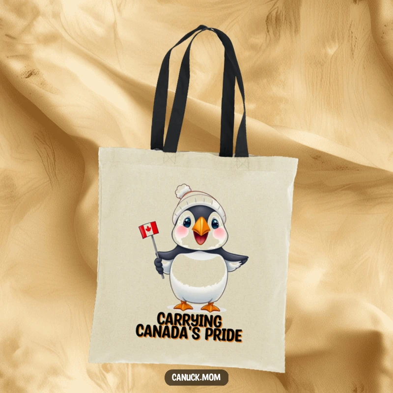 Funny Puffin Canada Tote Bag: A joyful puffin sports a tiny toque and holds a mini Canadian flag, ideal for daily use.